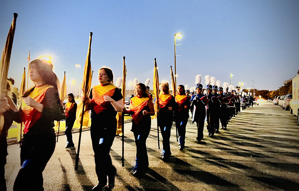 Park View High School color guard marching in front of the band